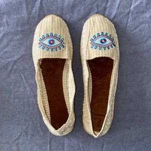 Handmade beige slip on evil eye shoes